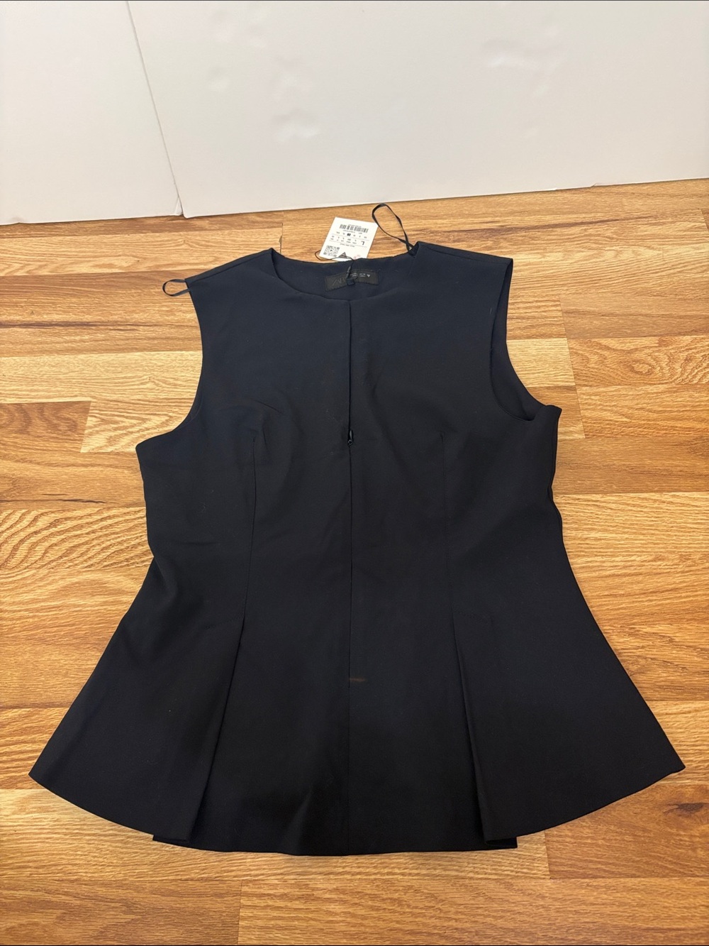 Zara navy blue sleeveless peplum top with a front zipper closure size L